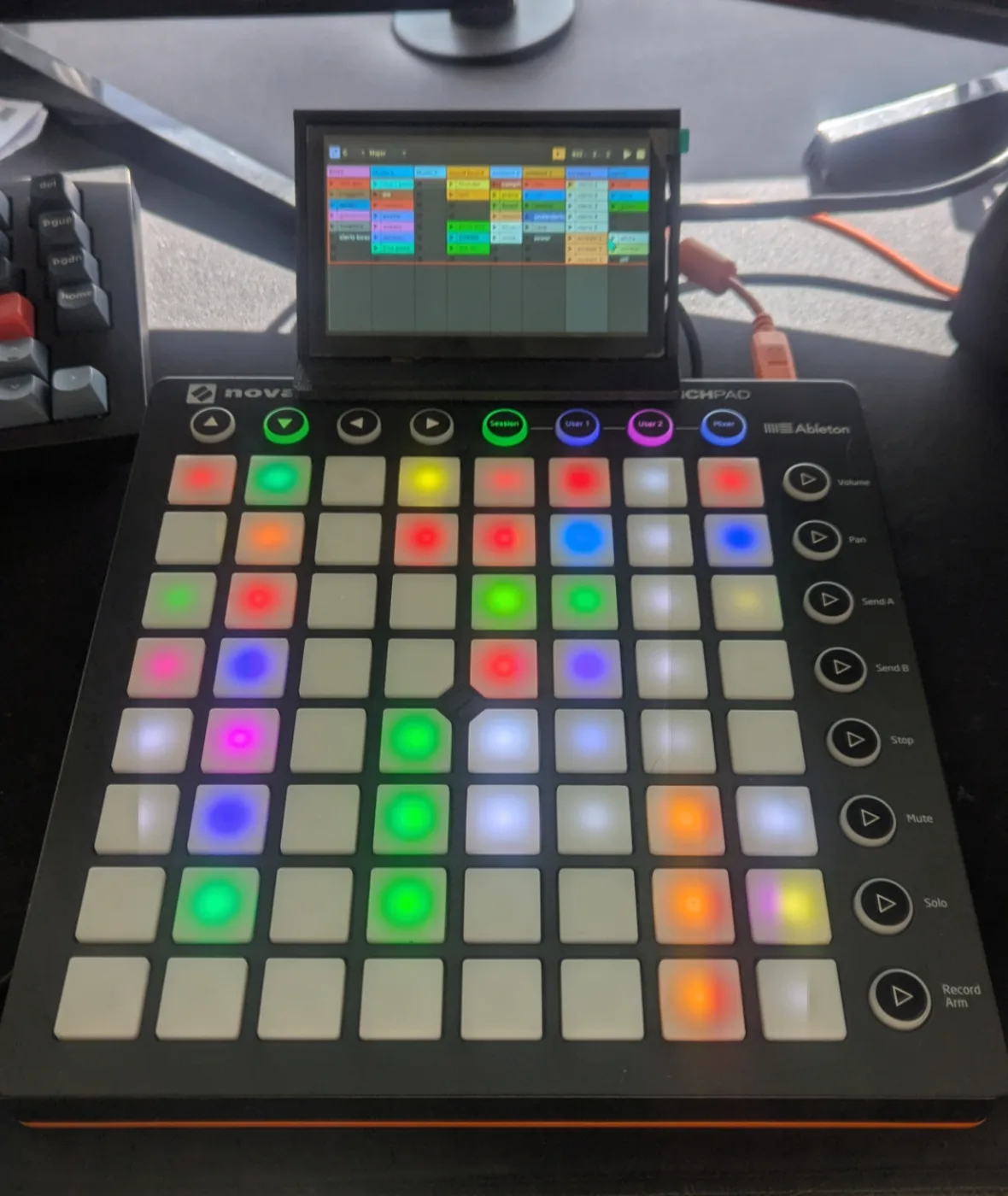 The Launchpad controller with a small screen mounted above it showing the soundboard grid
